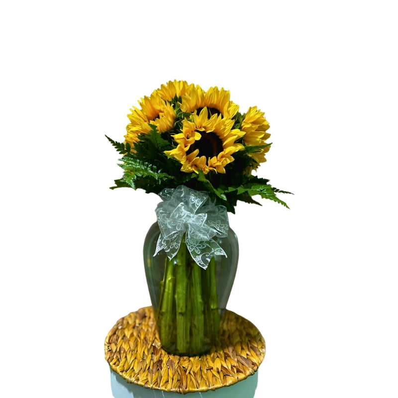 Florero de vidrio con girasoles